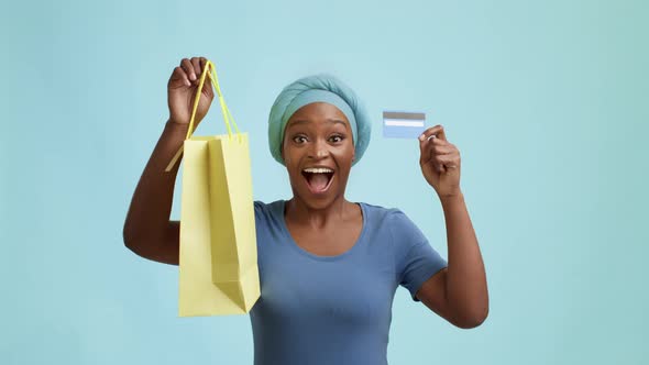 Black Lady Holding Credit Card And Shopping Bag Blue Background