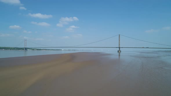 Rising flight over sandflats in the River Humber whilst flying towards the Humberbridge