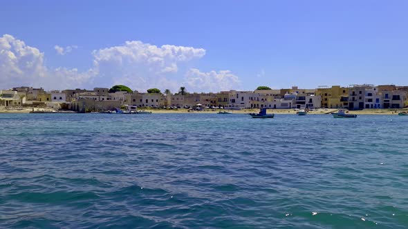 Favignana of Egadi islands as seen from boat, Sicily in Italy. Slow-motion and zoom out