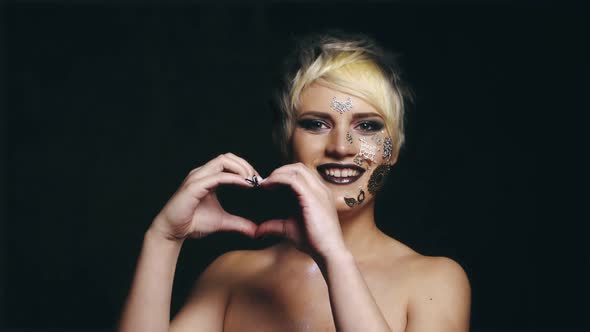 Woman Showing Heart Shaped Hands