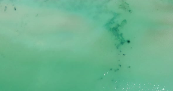 Bird's Eye View Of Turquoise Water And Seashore In Balchik, Bulgaria - aerial drone shot