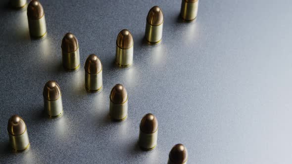 Cinematic rotating shot of bullets on a metallic surface - BULLETS 042
