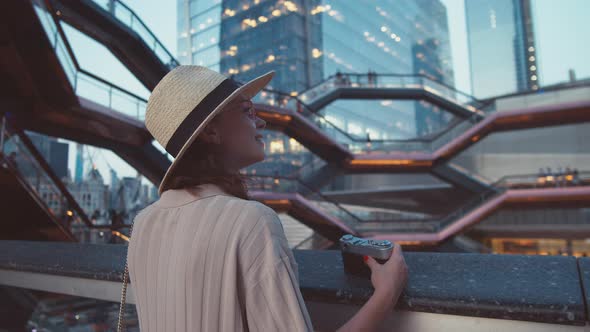 Young tourist with a retro camera in the Wessel building in New York