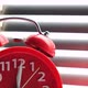 Red alarm clock rang at twelve clock, standing windowsill. - VideoHive Item for Sale