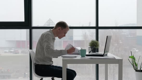 Concentrated Entrepreneur Working in the Office