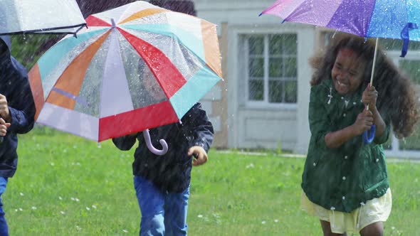 Happy Children Running in Rain