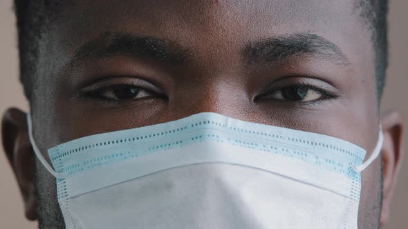 Extreme Close Up Male Face Young African American Man Guy Sick Patient in Medical Respiratory Mask