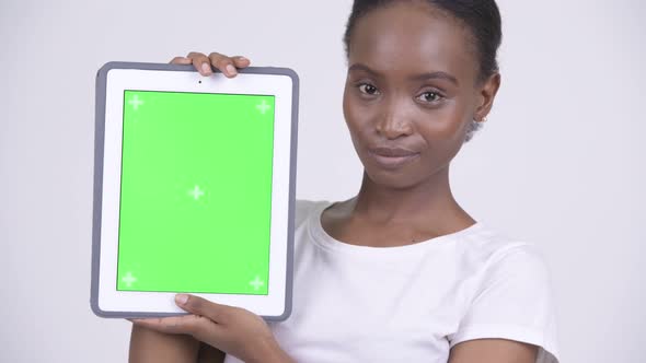 Face of Happy Young Beautiful African Woman Showing Digital Tablet