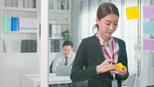 Asian young woman and man business people group have discussion meeting in office.