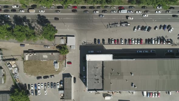 Top down Aerial view of traffic jam near the office building in city. 02