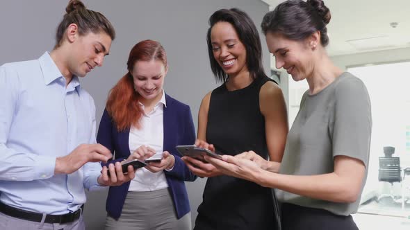 Executives using mobile phone in the office 4k