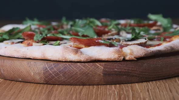 Appetizing Pizza on a Wooden Board in a Restaurant