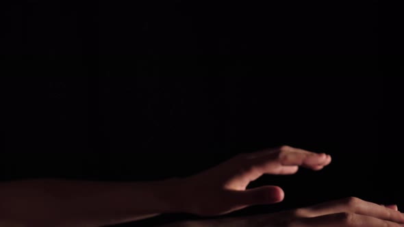 Hands Of A Pianist On A Black Background