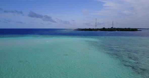 Luxury flying travel shot of a sunshine white sandy paradise beach and blue sea background in best q