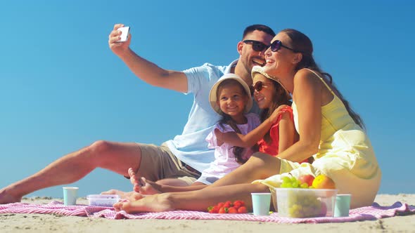 Happy Family Taking Selfie on Summer Beach