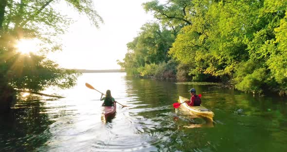 Two kayaks with people on the scenic river