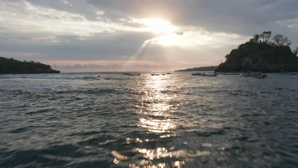 Sun Beaming From the Sky and Reflecting on the Beautiful Ocean Waters in Indonesia