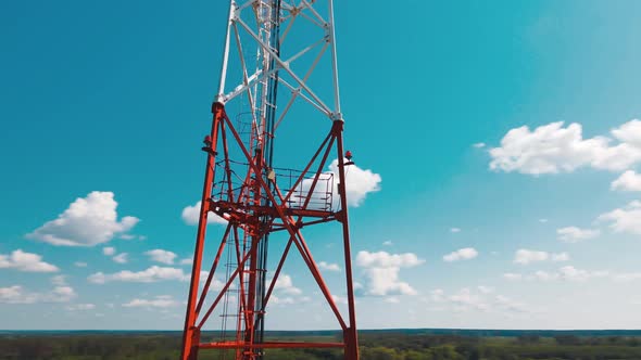 Aerial View of 4G and 5G Cell Tower with Antennas and Satellites