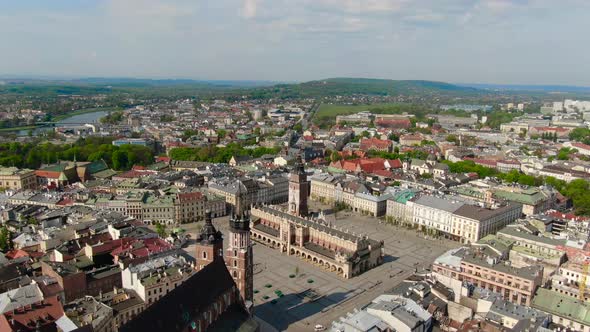 Flying over Main Square, Rynek Glowny in Krakow, Cracow city in Poland, Polska