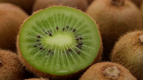 kiwi fruit. heap sliced and whole kiwi fruit close up