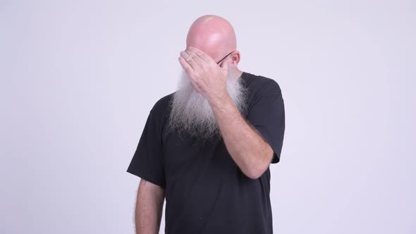 Stressed Mature Bald Bearded Man Not Wanting To See Something