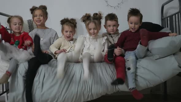 A group of children with New Year's gifts, happy friends for Christmas