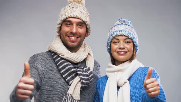 Happy Couple in Winter Clothes Showing Thumbs Up 9