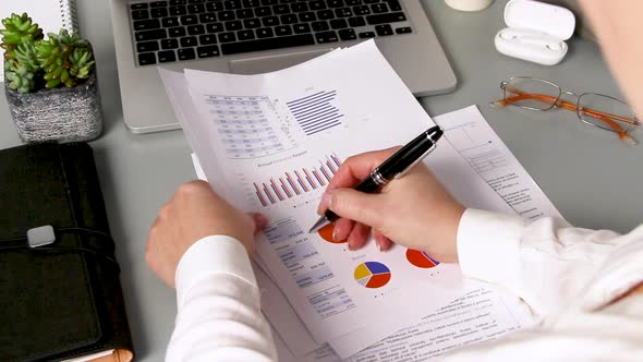 Business woman hands working with documents close up