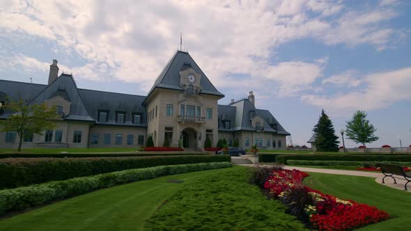 Flower garden in front of a beautiful mansion estate.