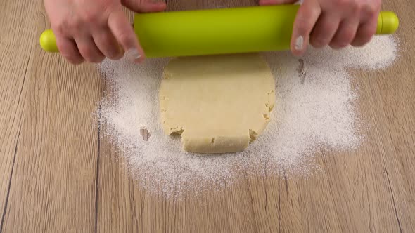 The process of making cookies from shortbread dough.