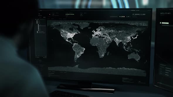 Intelligence Agent Investigates Map In High Tech Satellite Analysis Software alt