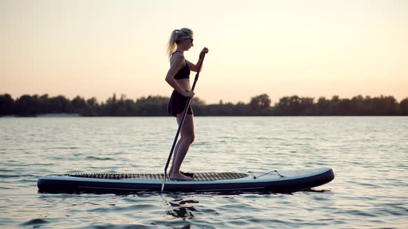 Sup.Sup Board Surfing.Woman Sup Surfing .Stand up Paddling Surfboard. Inflatable Board For Rowing.