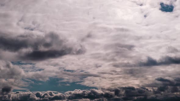 Timelapse of Gray Cumulus Clouds Moves in Blue Dramatic Sky Cirrus Cloud Space