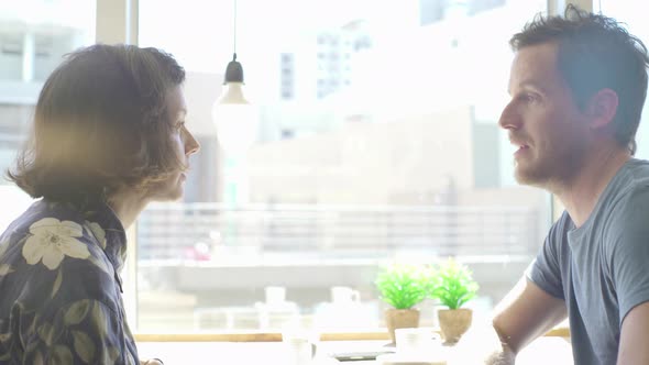 Man and woman together in coffee shop