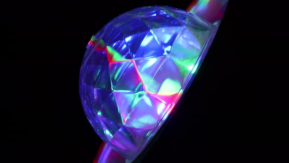 LED Disco Party Light Rotating And Producing Colorful Lights At Night. - close up