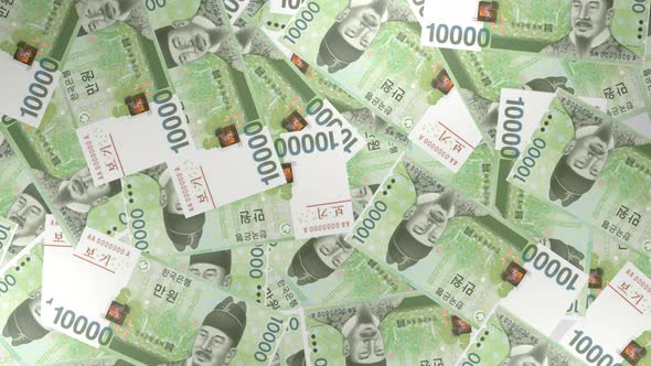 10000 South Korean won bills background. Many banknotes.
