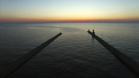 Drone sunset shot over Lake Michigan St. Joseph North and South Piers