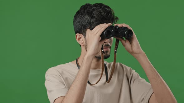 Close Up Happy Hispanic Guy Using Binoculars Indian Cheerful Tourist Looking Adventure Studio Green