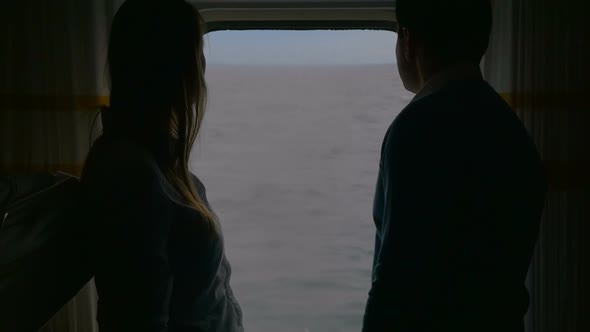 Couple Looking Out the Ferry Window