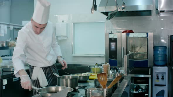 Chef Buttering Bread Before Toasting It on a Frying Pan