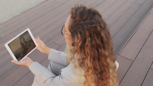 Business Woman Video Chatting on Tablet Outdoors