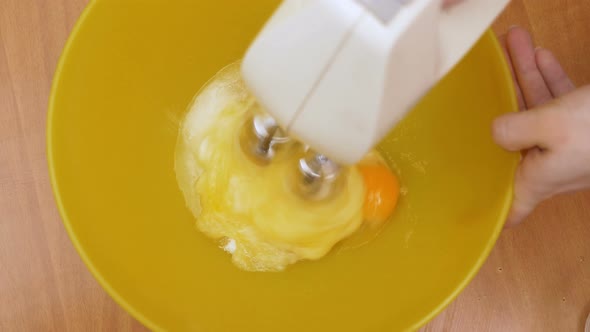 Mixing sugar and egges - Preparing dessert