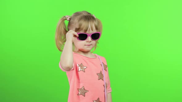 Positive Girl in Pink Blouse and Sunglasses Dancing and Posing. Chroma Key