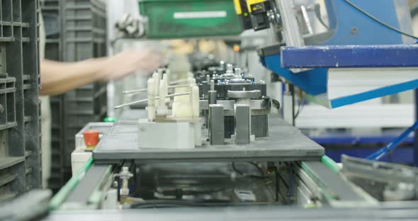 Worker in a Production line of parts for the automotive industry