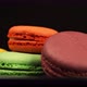 A Colorful Macaroons are rotating on a black dish - VideoHive Item for Sale