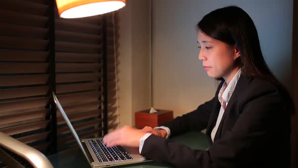 Businesswoman working at night 