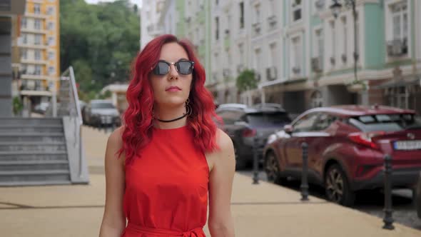 Red-haired Woman in a Red Dress