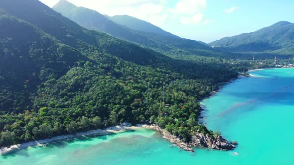 Aerial drone view scenery of relaxing seashore beach lifestyle by blue water and white sandy backgro