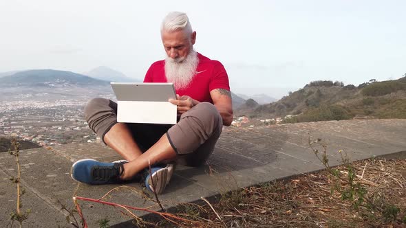 Senior Man with Laptop