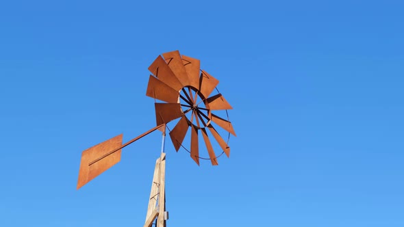 Windmill with Brown Blades Used to Extract Water in the Dry Terrain of African Countries